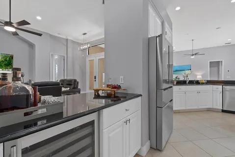 a view of a living room and a floor to ceiling window