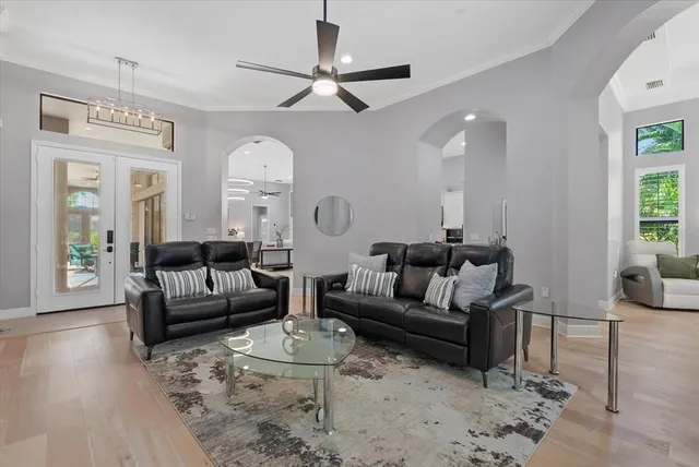 a bed room with a bed and a chandelier