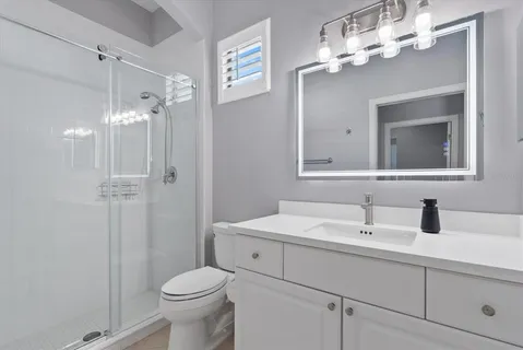 an aerial view of residential houses with outdoor space and river