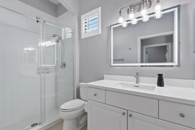 an aerial view of residential houses with outdoor space and river