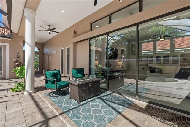 an aerial view of residential houses with outdoor space and lake view
