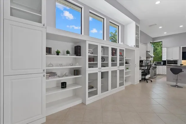 a kitchen with stainless steel appliances granite countertop a stove and a microwave