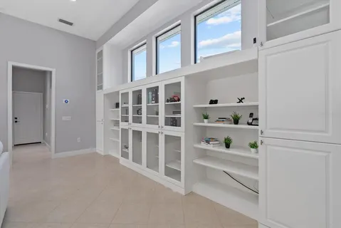 a kitchen with granite countertop a stove and a sink