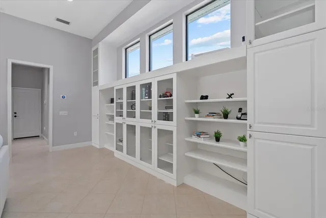 a kitchen with granite countertop a stove and a sink