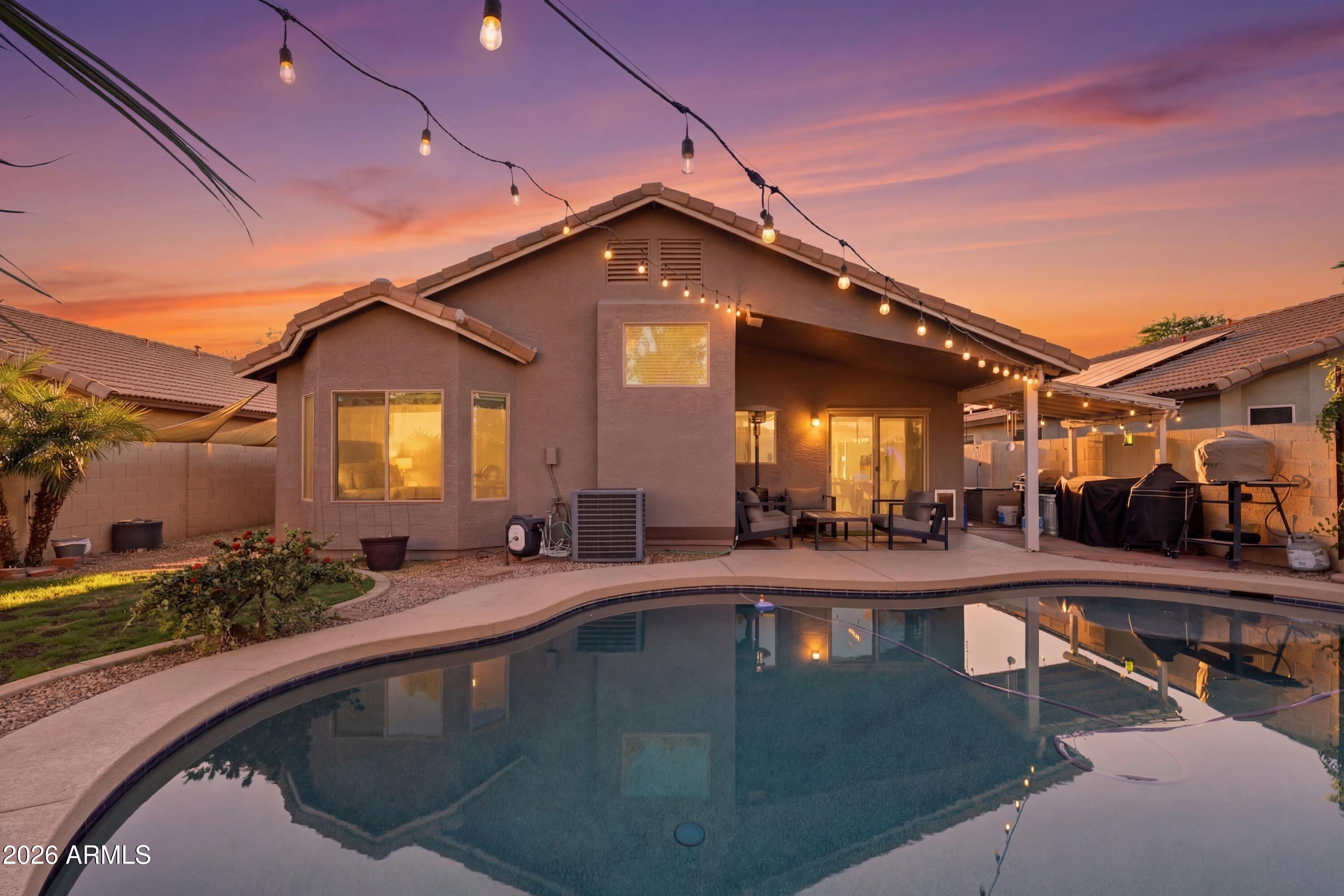 661 North Joshua Tree Lane Gilbert, AZ 85234 - Photo 34 of 47 a swimming pool view with a outdoor seating