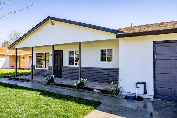 a view of house with backyard