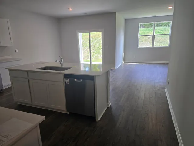 a kitchen with sink and cabinets