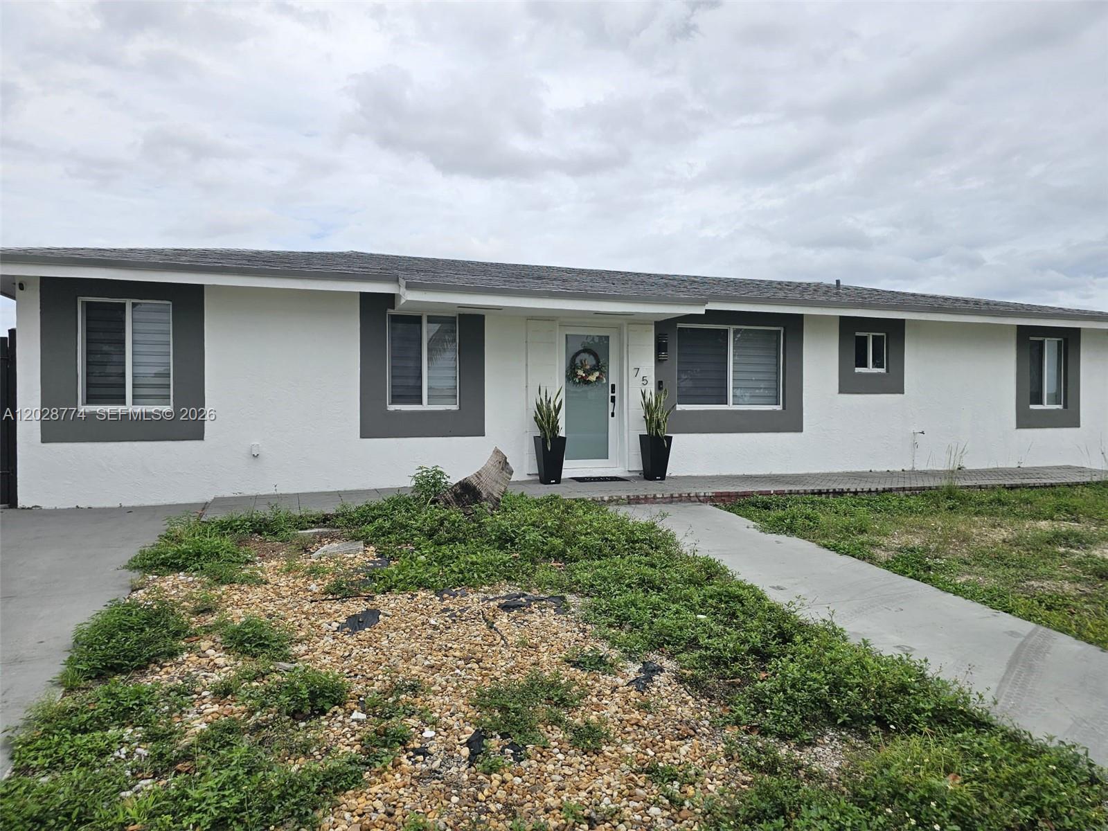front view of house with a yard