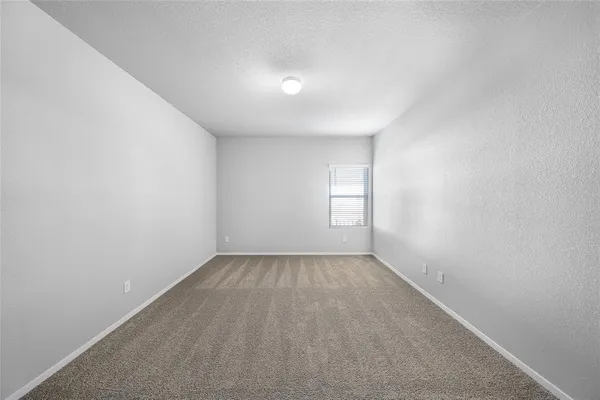 an empty room with a empty space and window