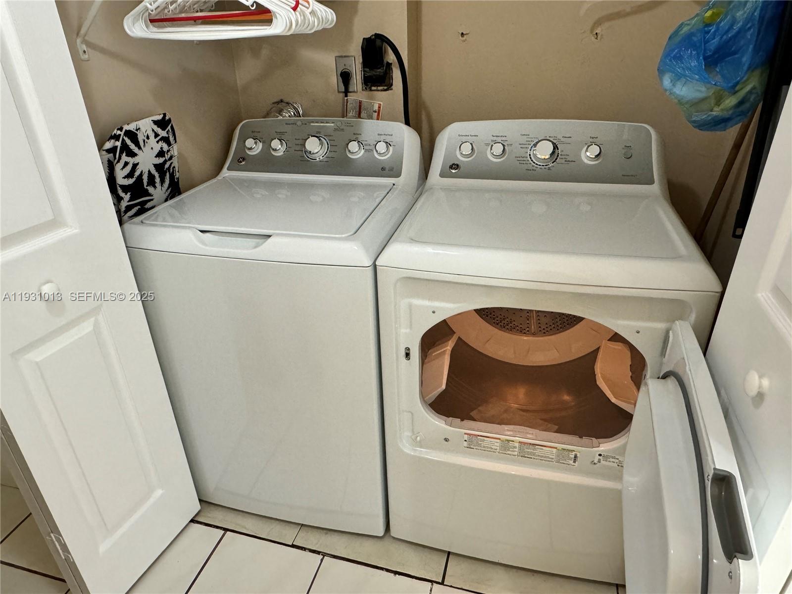9411 Southwest 4th Street, Unit 111 Miami, FL 33174 - Photo 10 of 28 a utility room with dryer and washer