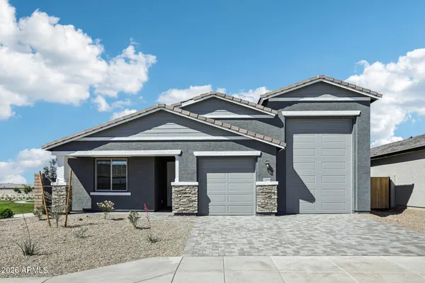 a front view of a house with garage
