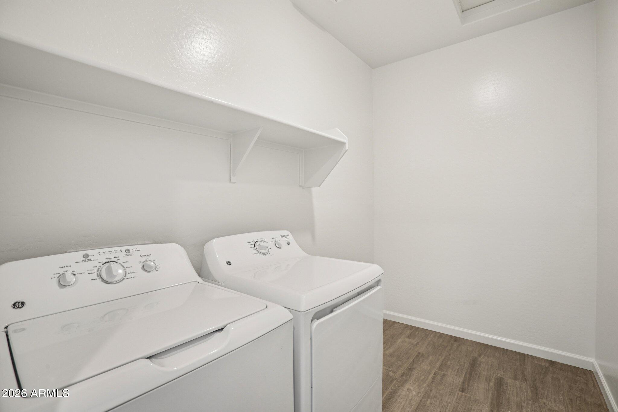 32094 Buckaroo Road San Tan Valley, AZ 85140 - Photo 18 of 46 a utility room with dryer and washer