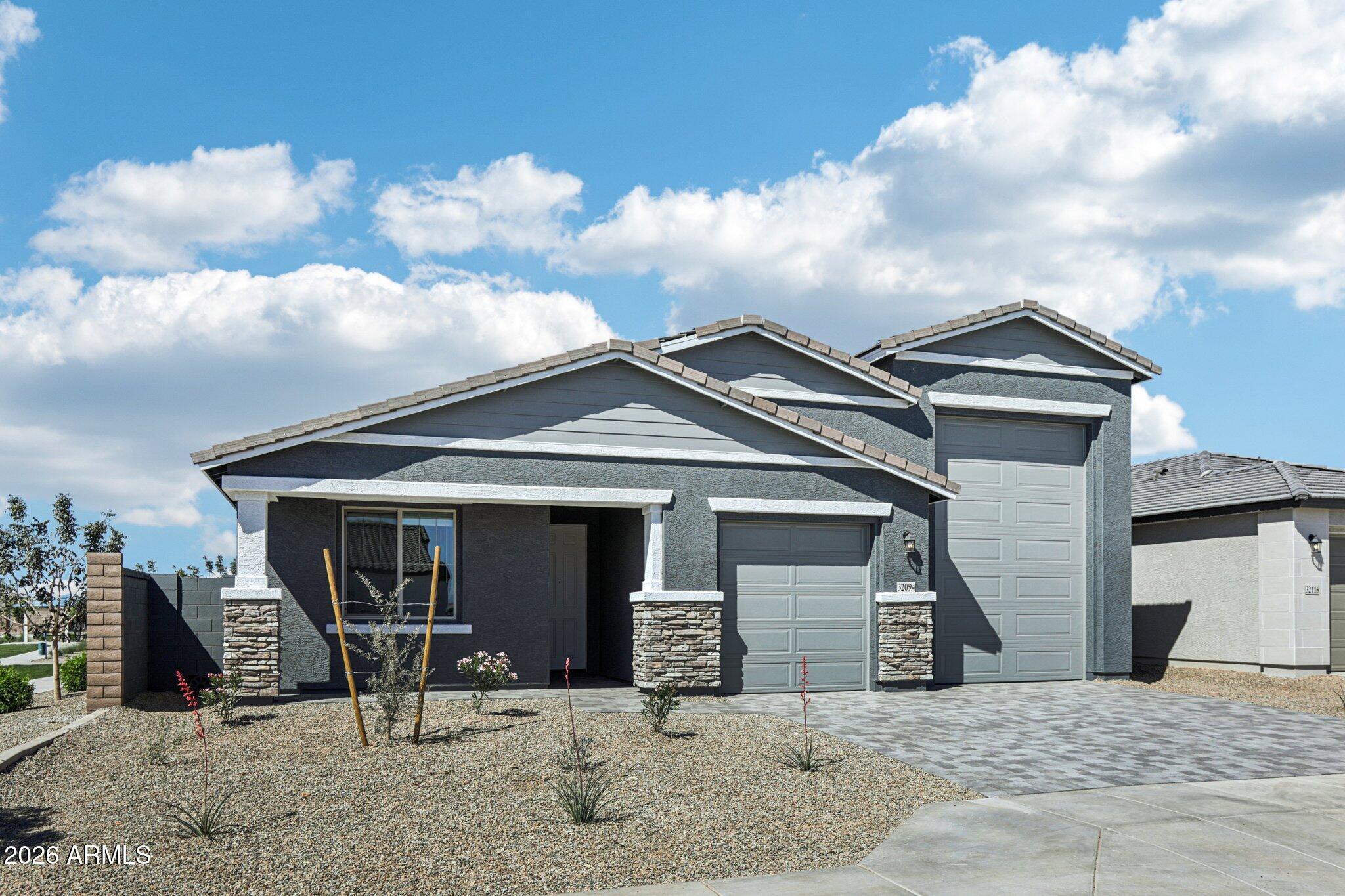32094 Buckaroo Road San Tan Valley, AZ 85140 - Photo 2 of 46 a view of a house with backyard