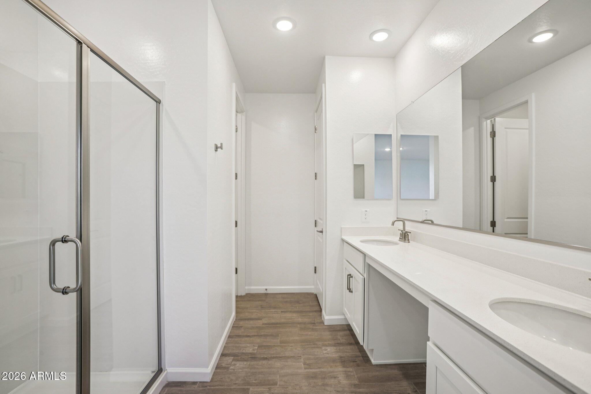 32094 Buckaroo Road San Tan Valley, AZ 85140 - Photo 27 of 46 a spacious bathroom with a double vanity sink and a mirror