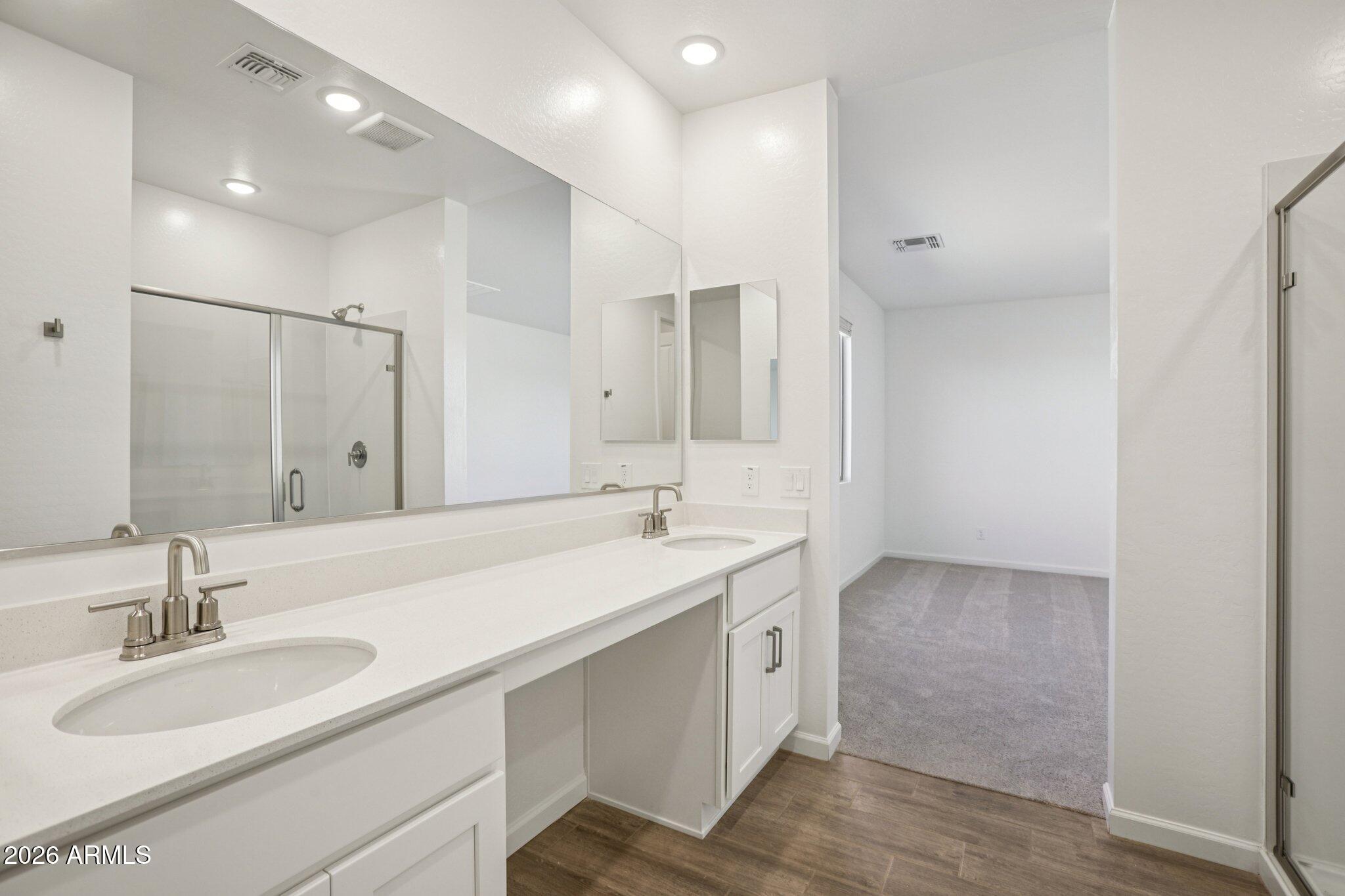32094 Buckaroo Road San Tan Valley, AZ 85140 - Photo 29 of 46 a bathroom with a sink double vanity and a mirror