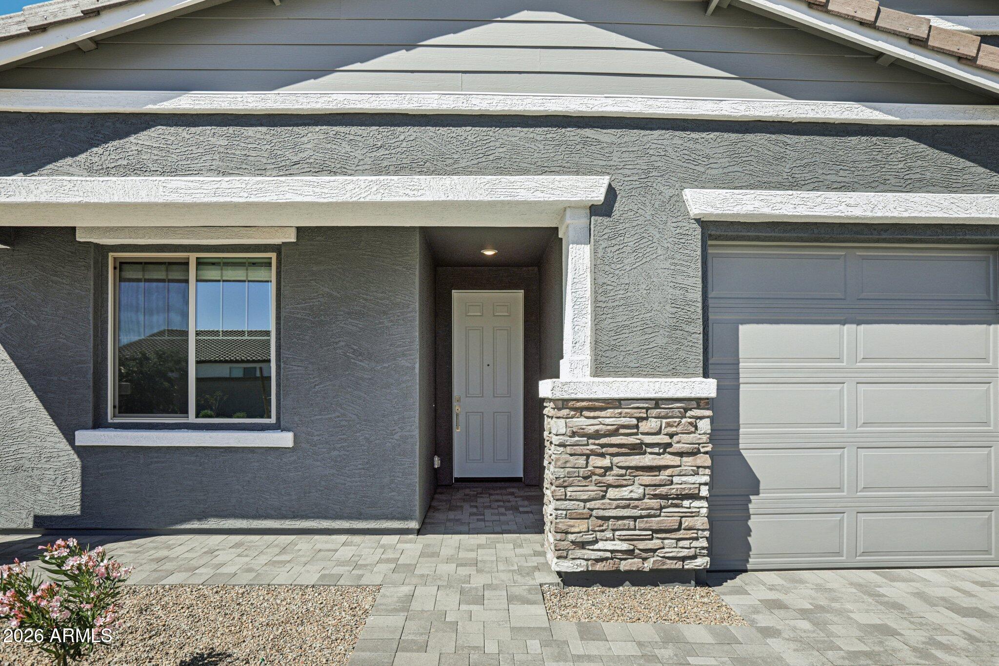 32094 Buckaroo Road San Tan Valley, AZ 85140 - Photo 4 of 46 a front view of a house