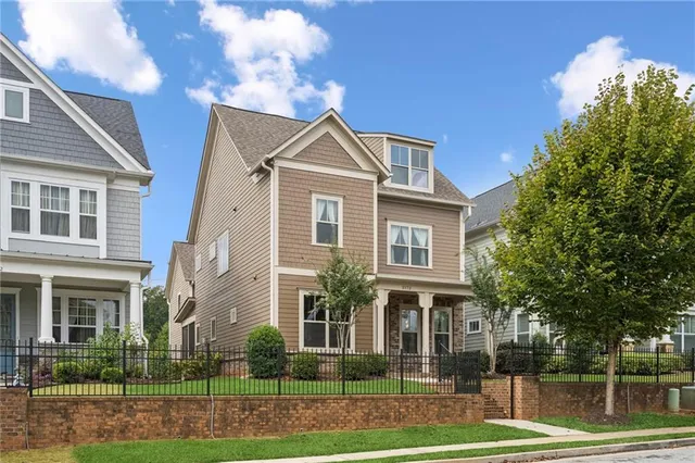 a front view of a house with a yard
