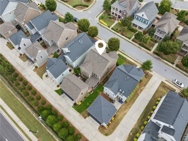 an aerial view of residential houses with outdoor space