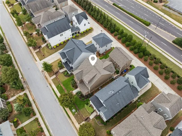 an aerial view of a house with a garden