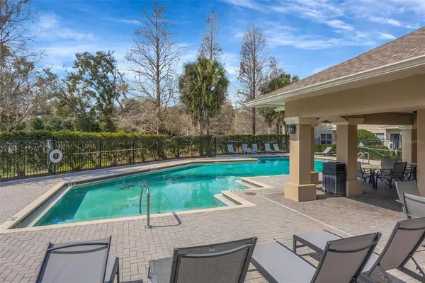 a view of a patio with swimming pool