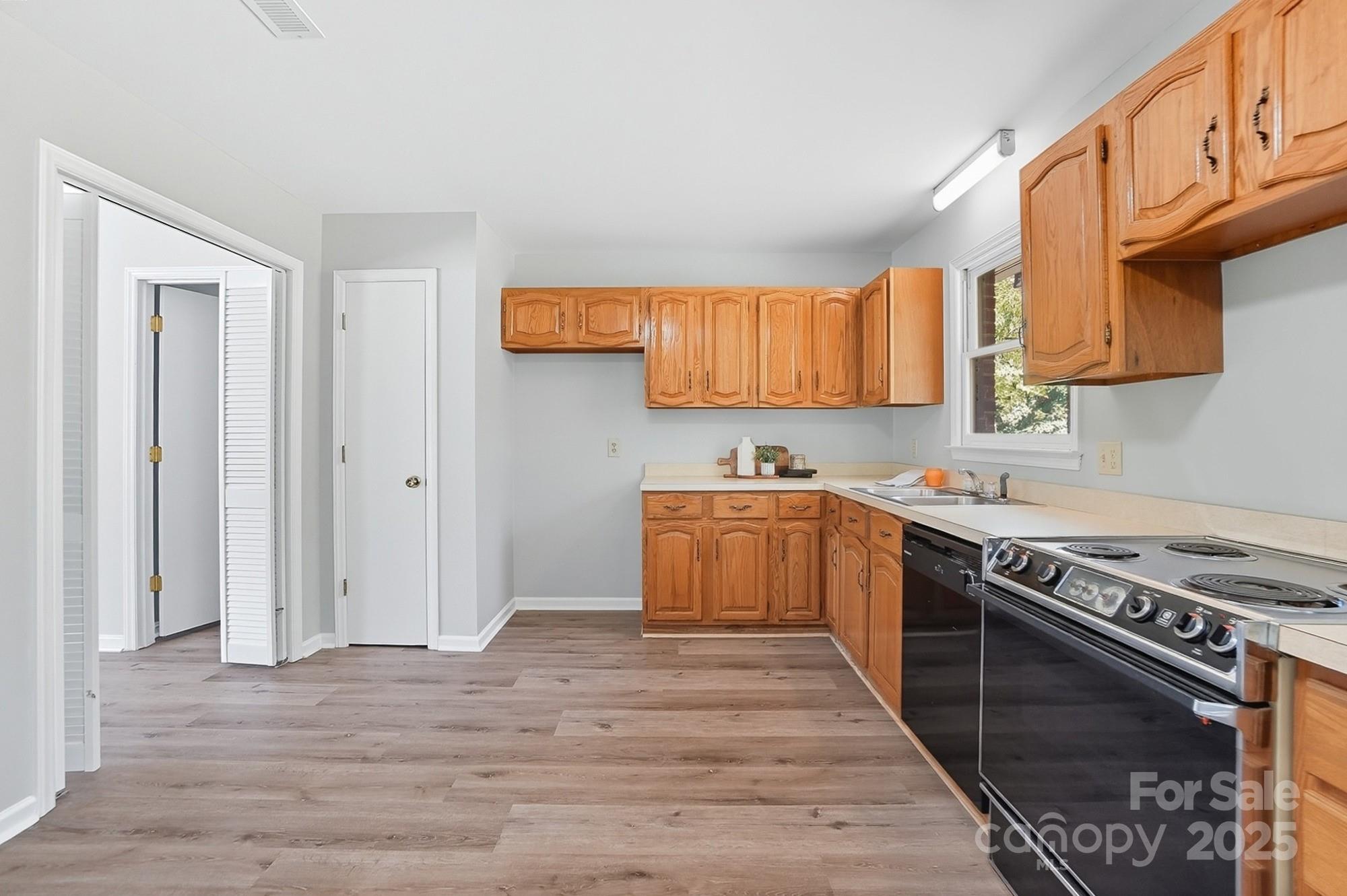 3230 West Innes Street Salisbury, NC 28144 - Photo 18 of 44 a kitchen with stainless steel appliances granite countertop a stove a sink and a refrigerator