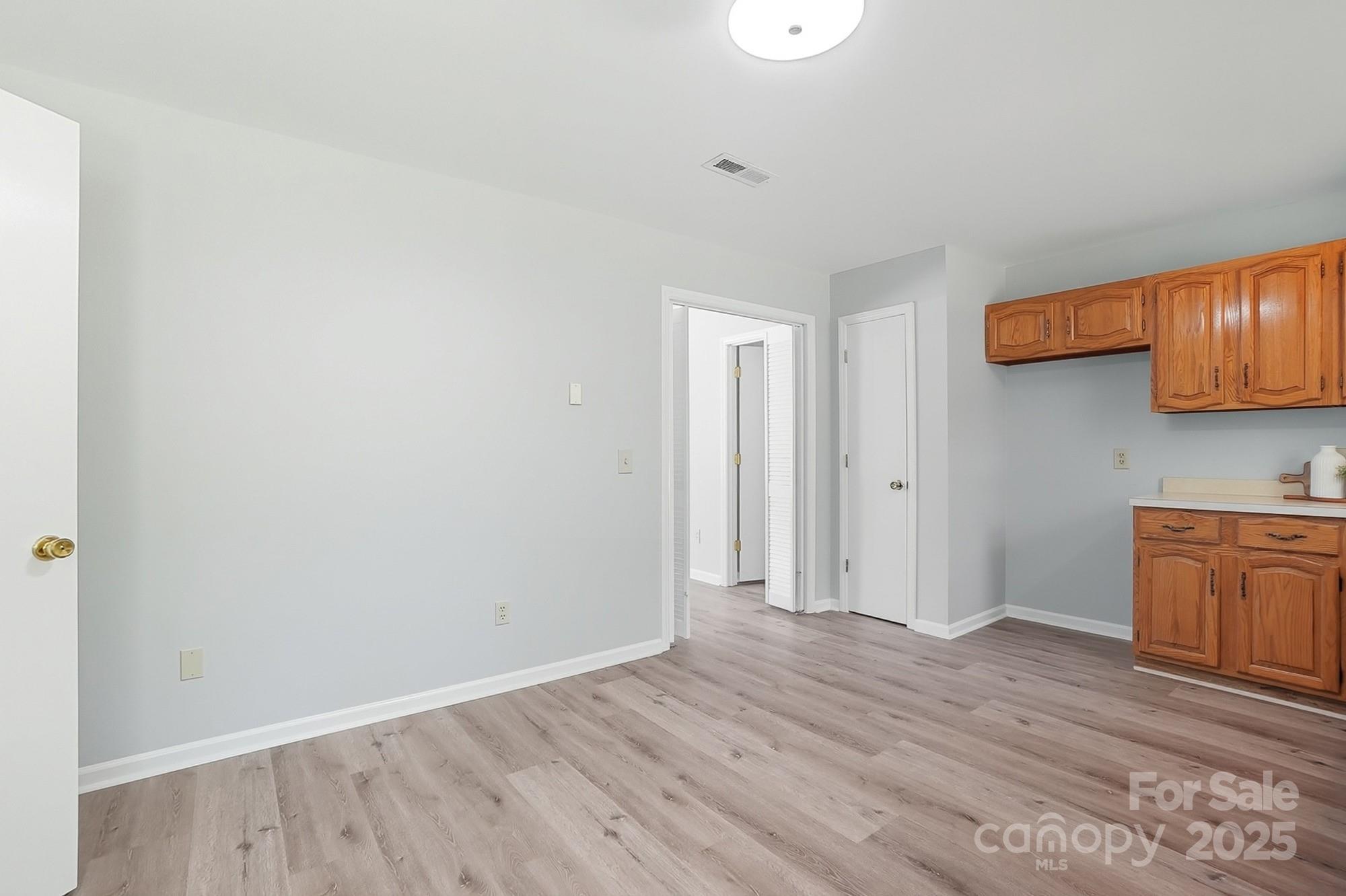 3230 West Innes Street Salisbury, NC 28144 - Photo 19 of 44 a view of a kitchen with wooden floor and electronic appliances