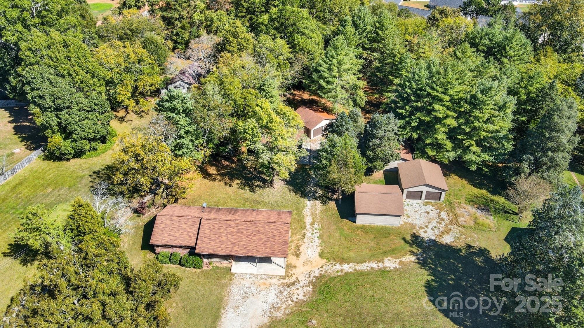 3230 West Innes Street Salisbury, NC 28144 - Photo 2 of 44 an aerial view of a house with yard and swimming pool