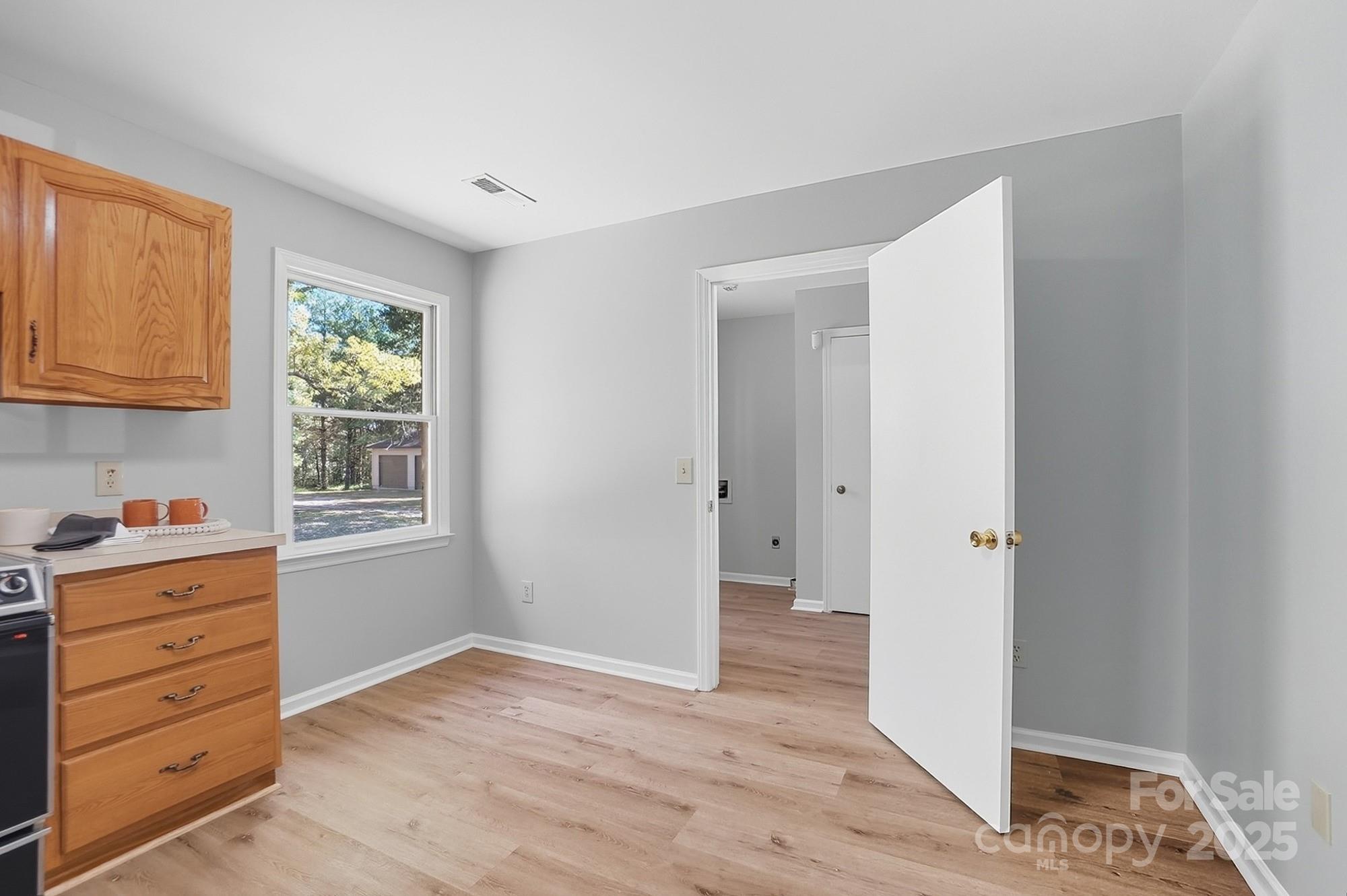 3230 West Innes Street Salisbury, NC 28144 - Photo 21 of 44 a view of hallway with window and wooden floor