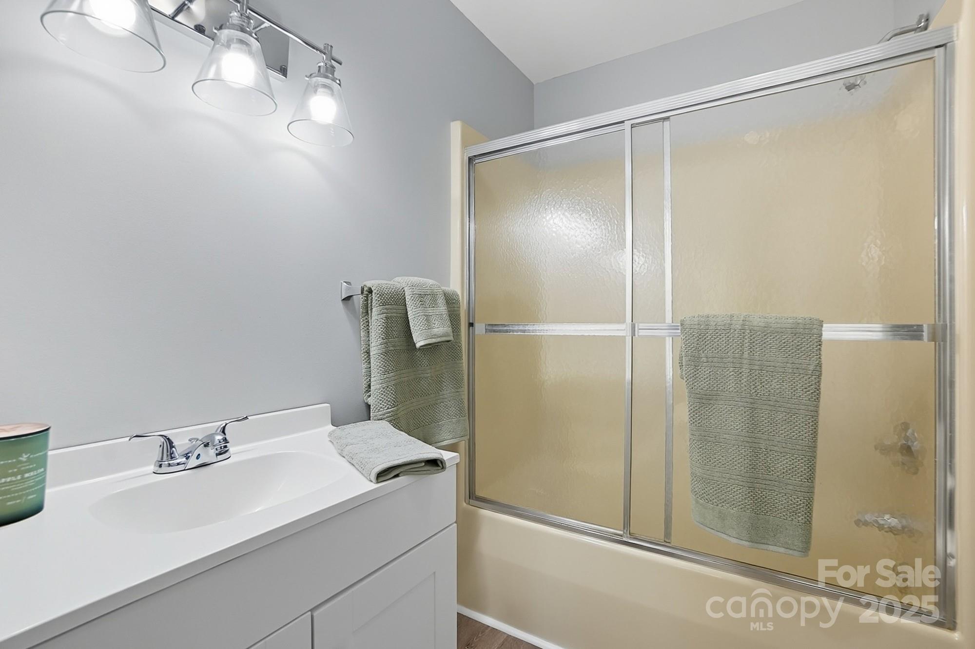 3230 West Innes Street Salisbury, NC 28144 - Photo 32 of 44 a bathroom with a sink and mirror