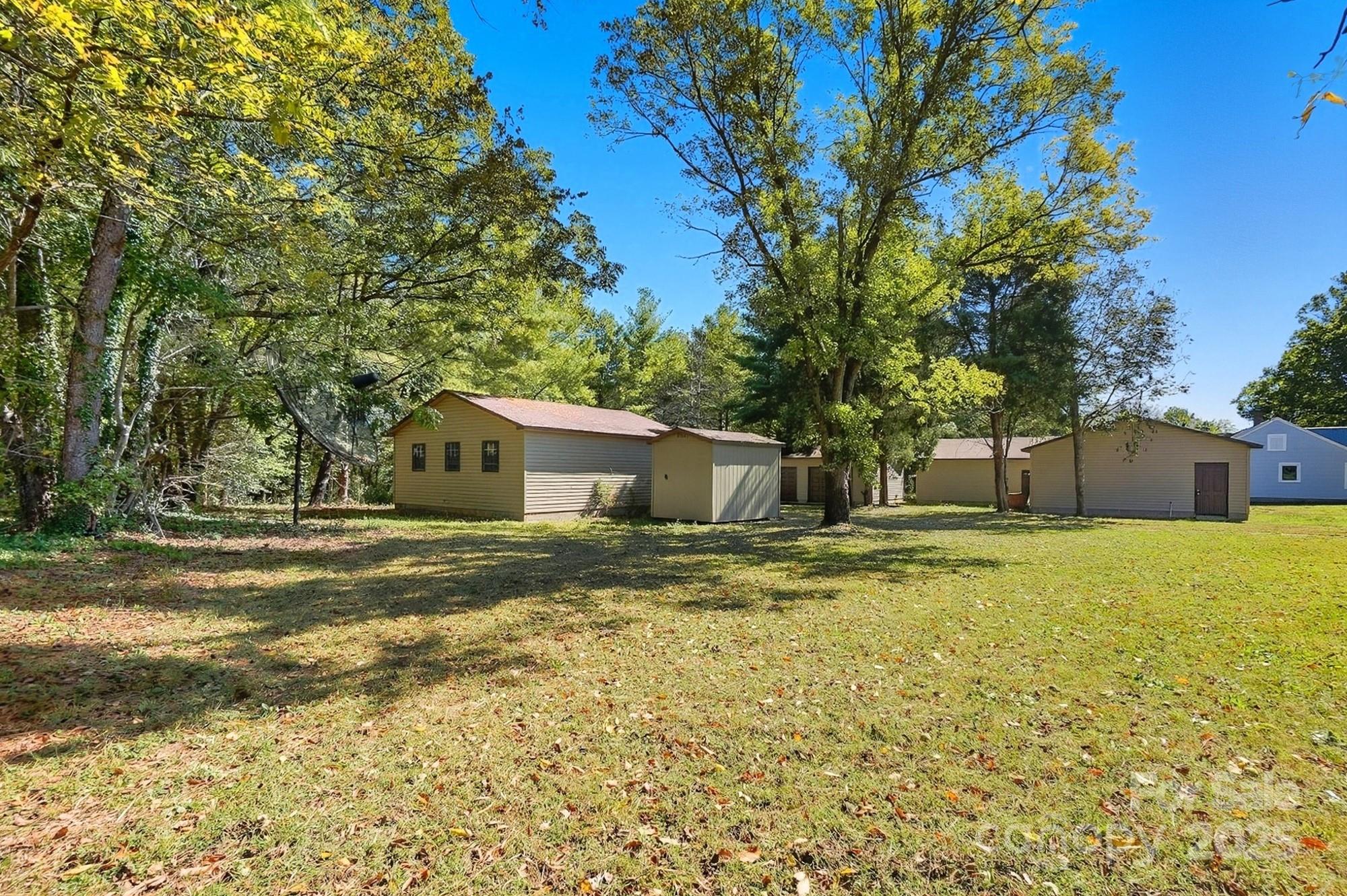 3230 West Innes Street Salisbury, NC 28144 - Photo 44 of 44 a view of a house with backyard and trees