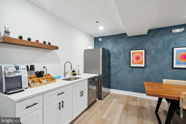 a spacious bathroom with a double vanity sink and a mirror