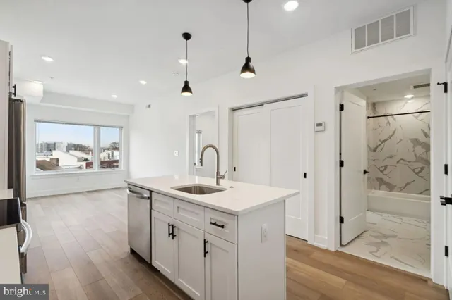 a view of a bathroom sink and a mirror