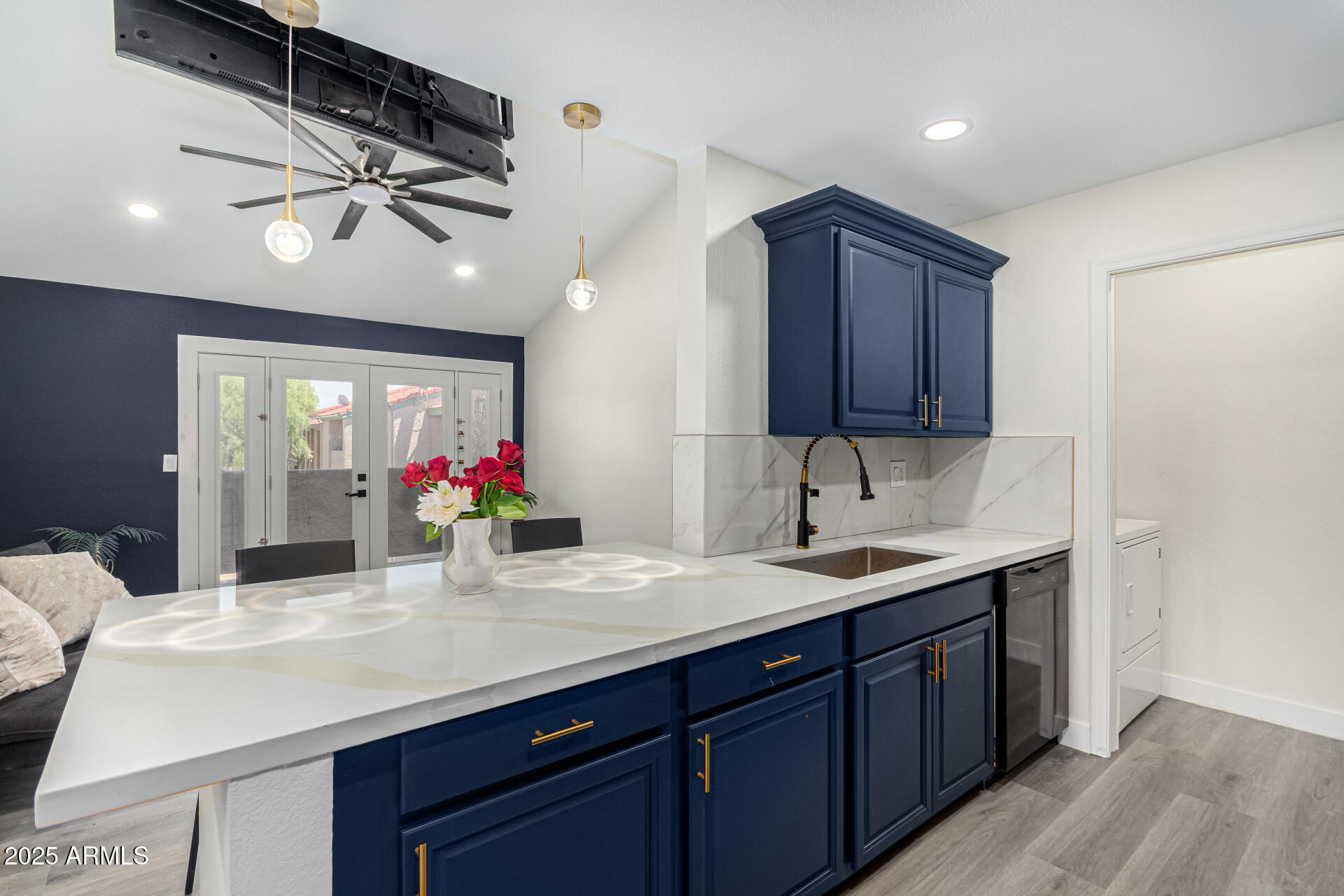 623 West Guadalupe Road, Unit 254 Mesa, AZ 85210 - Photo 1 of 30 a kitchen with a sink cabinets and wooden floor