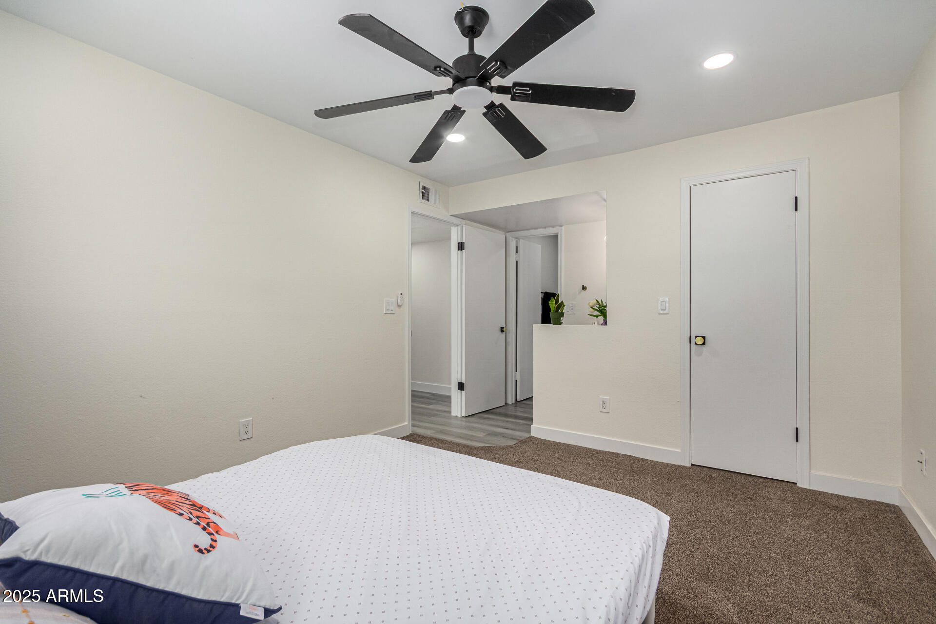 623 West Guadalupe Road, Unit 254 Mesa, AZ 85210 - Photo 11 of 30 a bedroom with a bed and a ceiling fan