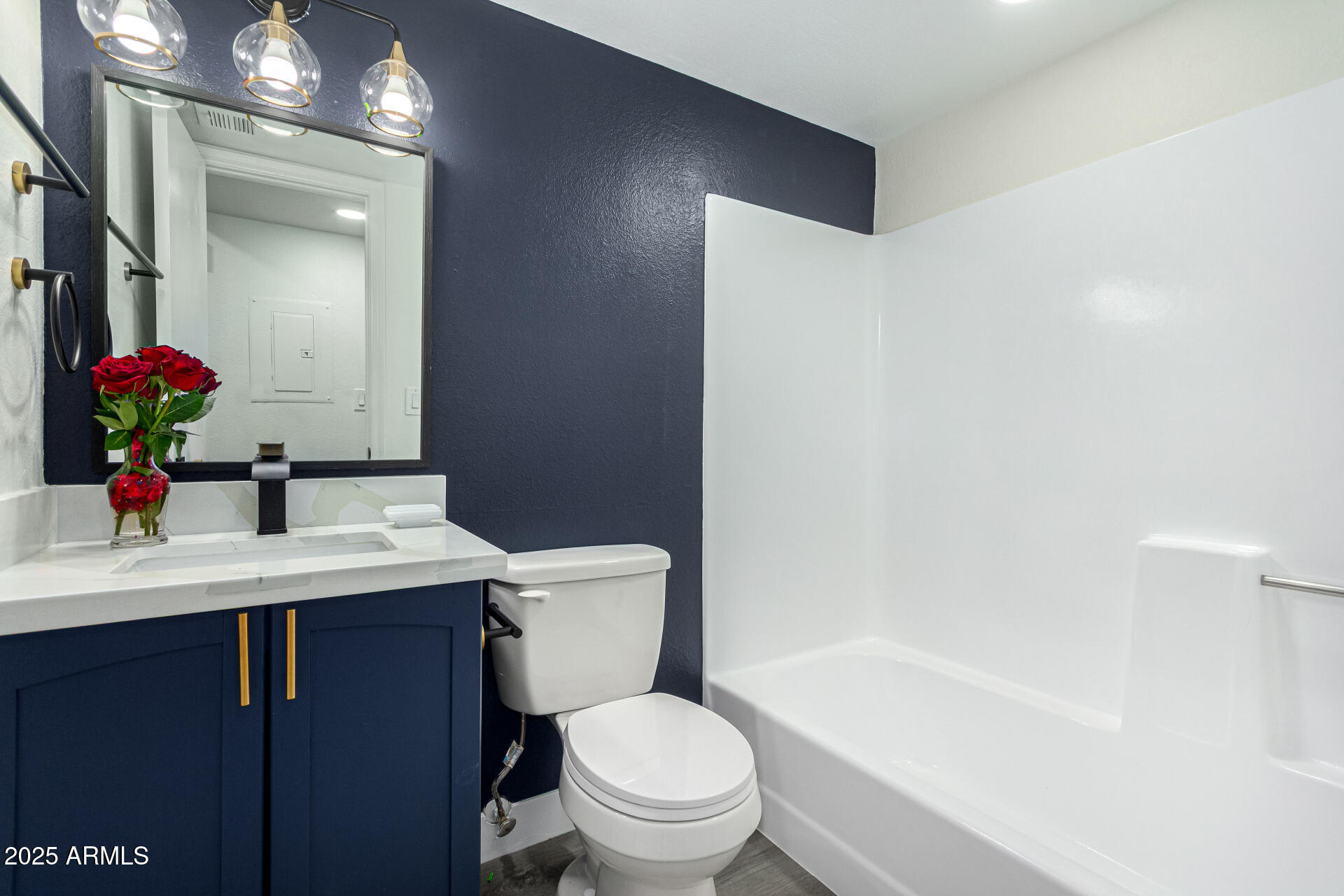 623 West Guadalupe Road, Unit 254 Mesa, AZ 85210 - Photo 16 of 30 a bathroom with a sink a toilet a mirror and vanity