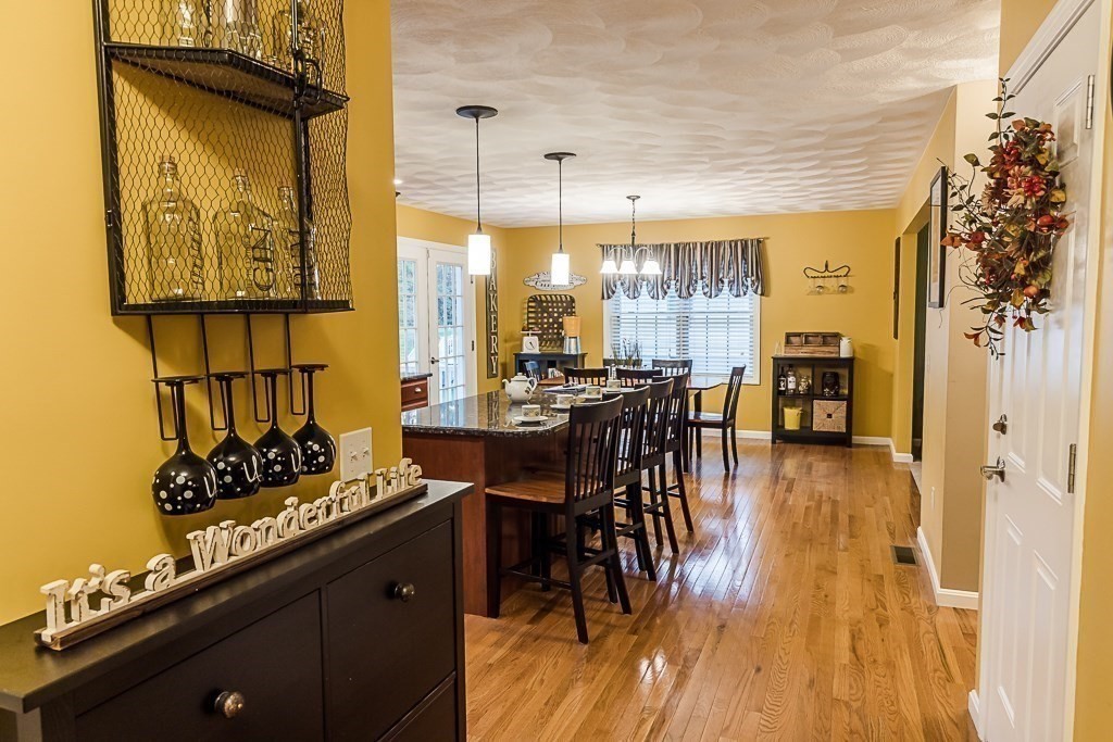 77 Baker Road Salisbury, MA 01952 - Photo 11 of 42 a view of a dining room with furniture window and wooden floor