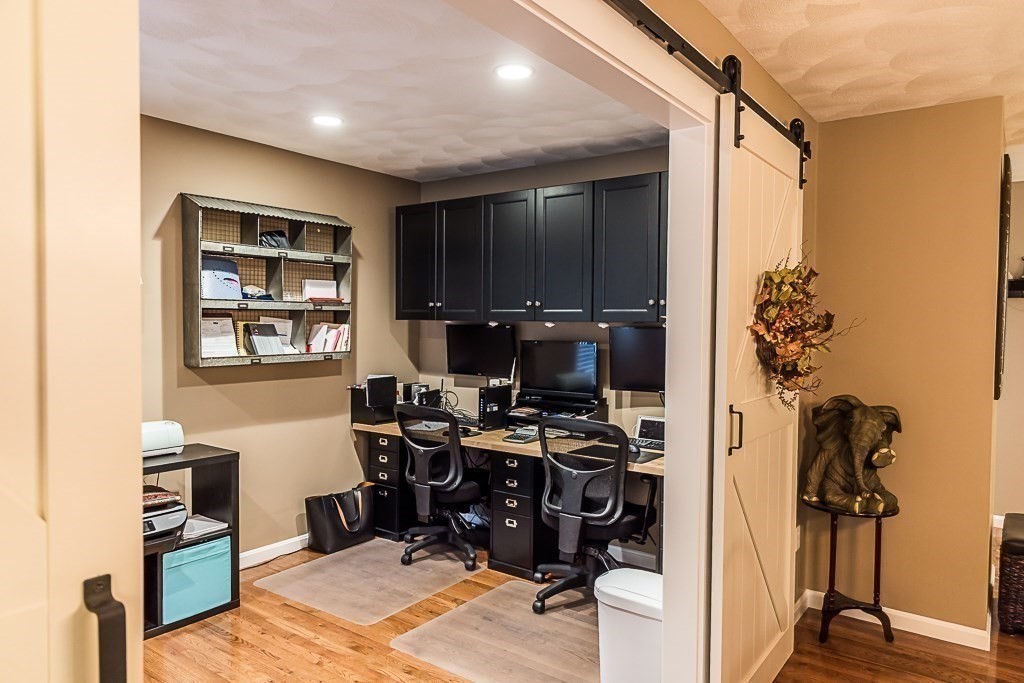 77 Baker Road Salisbury, MA 01952 - Photo 22 of 42 a workspace with furniture and a gate