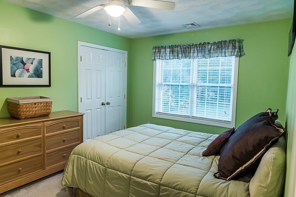 77 Baker Road Salisbury, MA 01952 - Photo 30 of 42 a bedroom with a bed and a window