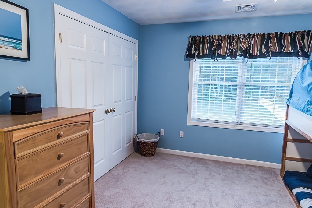 77 Baker Road Salisbury, MA 01952 - Photo 32 of 42 a room with a bed and a window