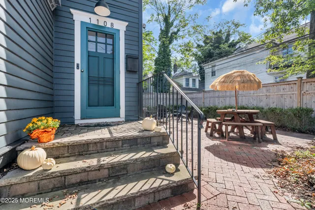 a balcony filled with furniture and rug