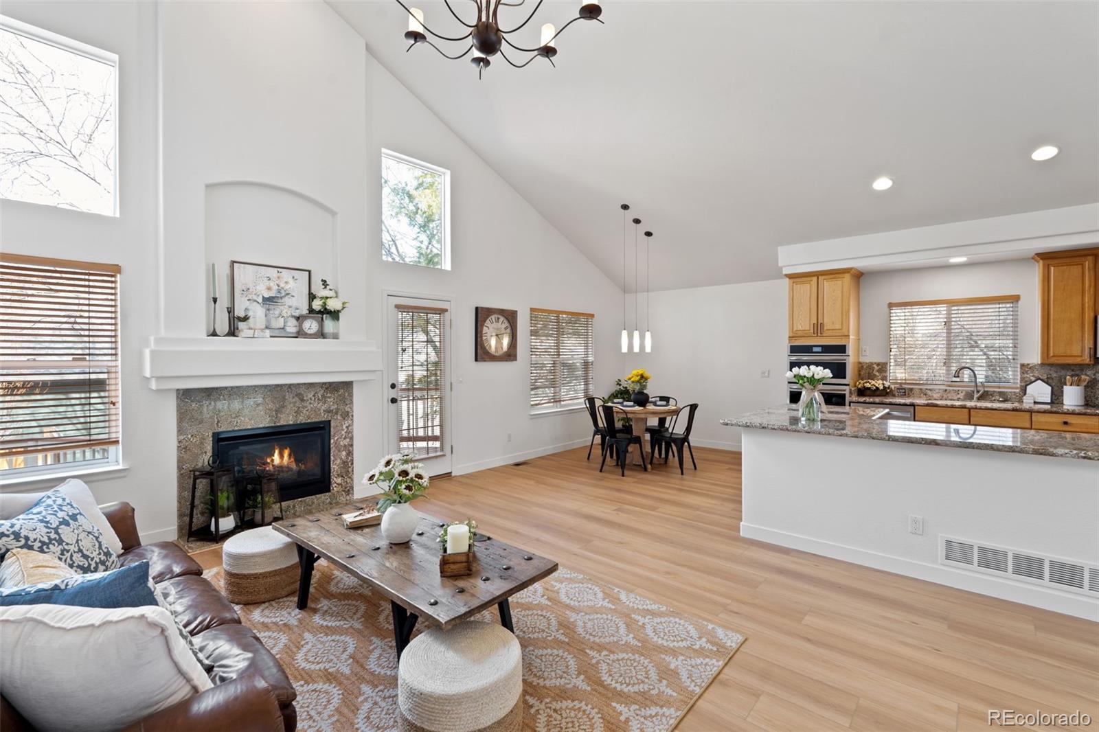 9838 Cypress Point Circle Lone Tree, CO 80124 - Photo 13 of 50 a living room with furniture and fireplace
