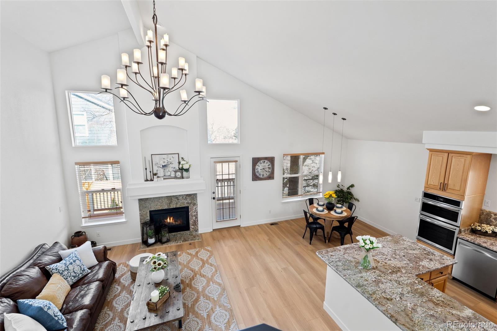9838 Cypress Point Circle Lone Tree, CO 80124 - Photo 14 of 50 a bedroom with furniture and a fireplace