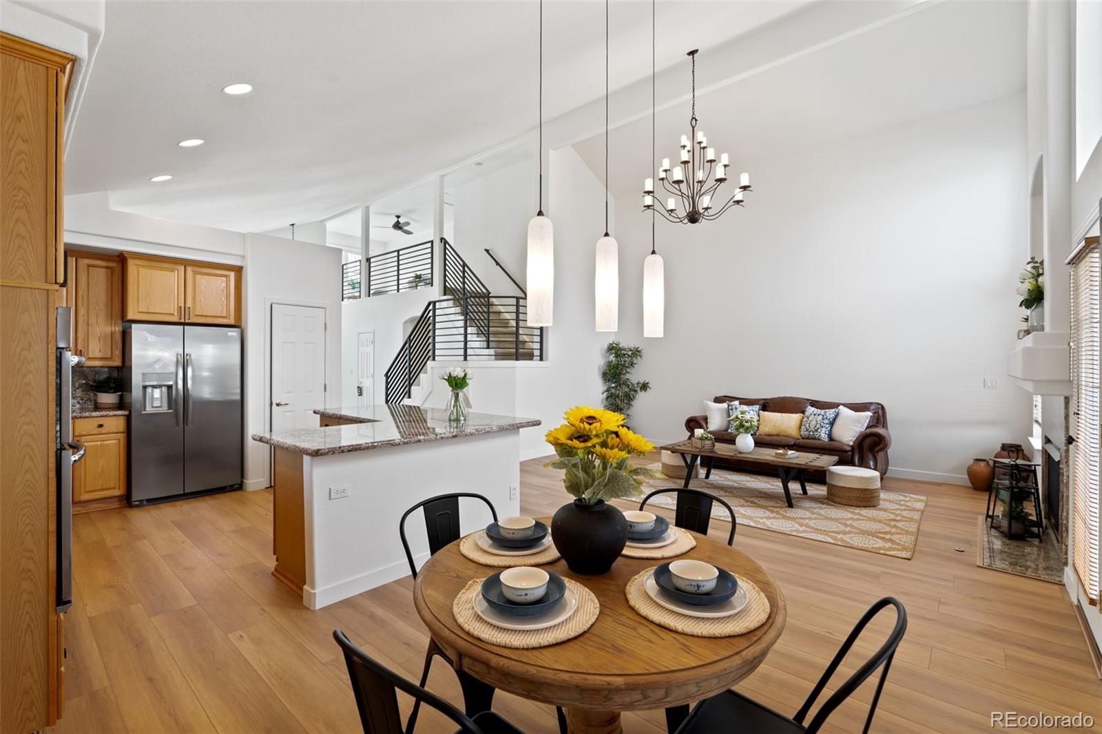 9838 Cypress Point Circle Lone Tree, CO 80124 - Photo 18 of 50 a view of a dining room with furniture and wooden floor