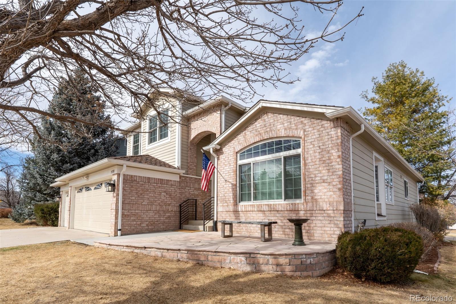 9838 Cypress Point Circle Lone Tree, CO 80124 - Photo 2 of 50 a view of a house with a yard