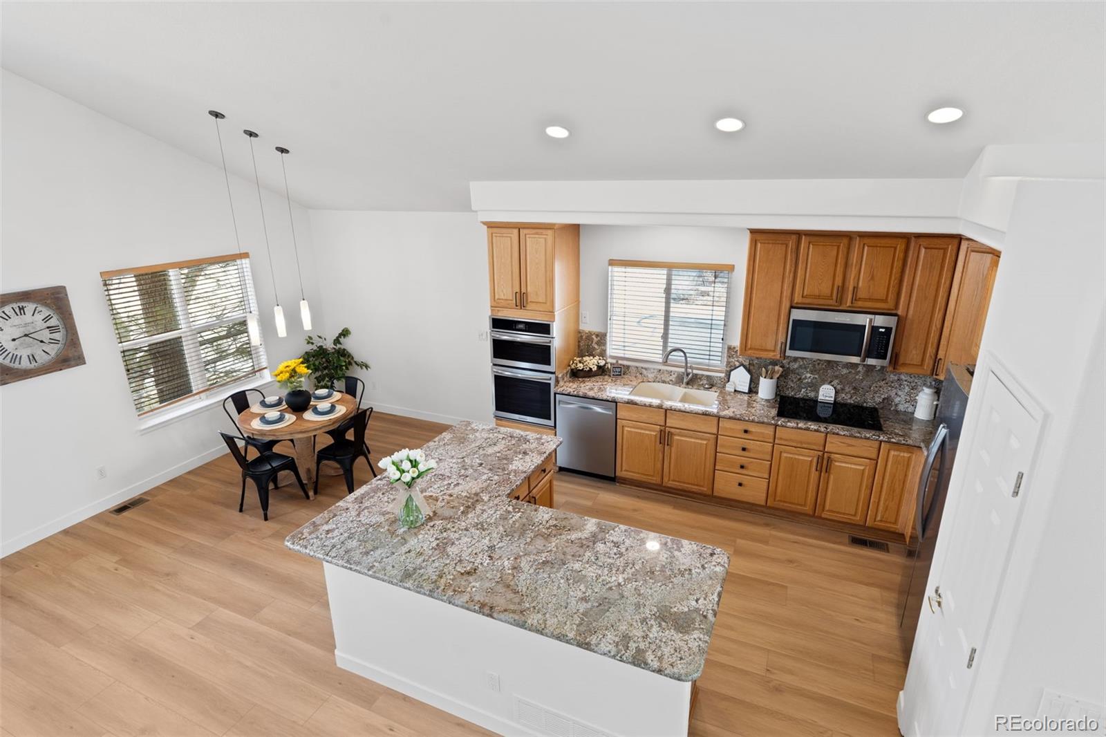 9838 Cypress Point Circle Lone Tree, CO 80124 - Photo 22 of 50 a living room with furniture and a kitchen