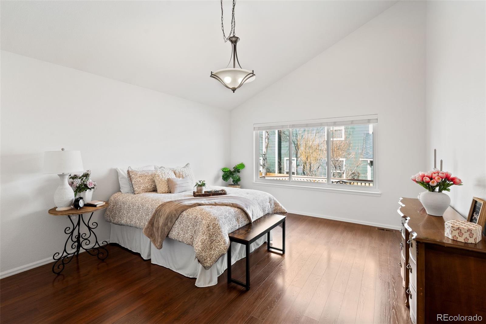 9838 Cypress Point Circle Lone Tree, CO 80124 - Photo 23 of 50 a bed room with bed and a window