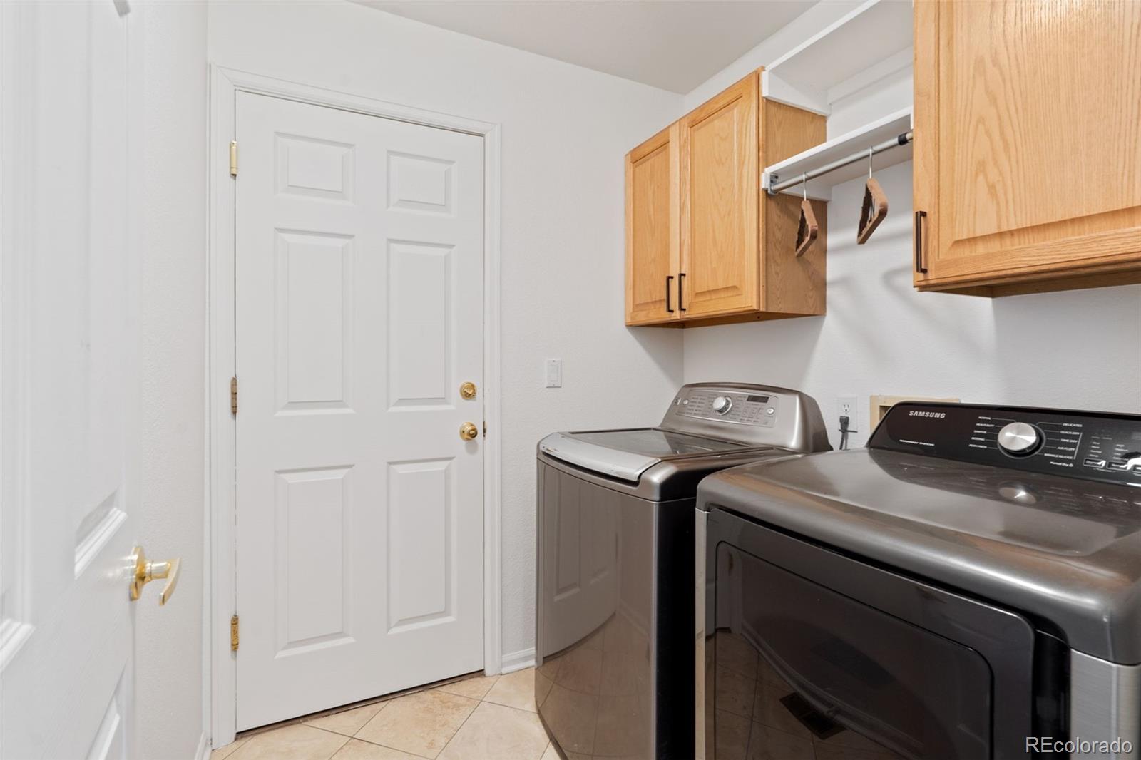 9838 Cypress Point Circle Lone Tree, CO 80124 - Photo 31 of 50 a utility room with dryer and washer