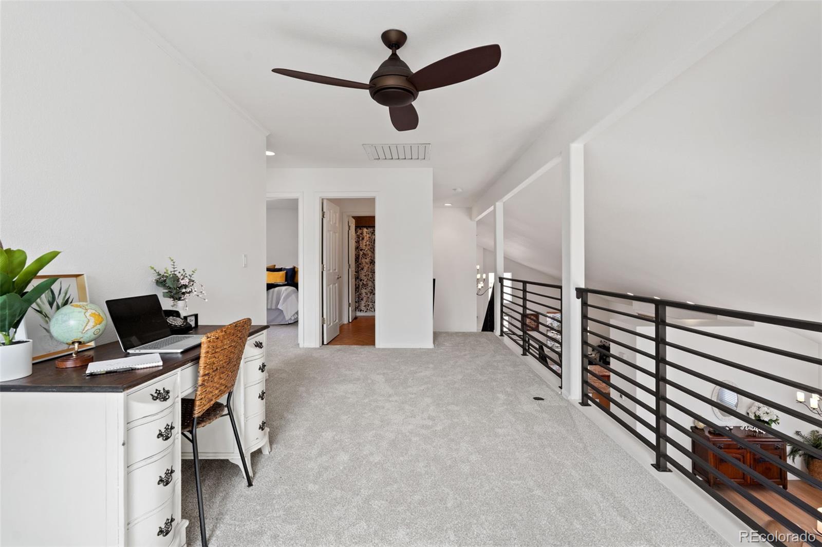 9838 Cypress Point Circle Lone Tree, CO 80124 - Photo 33 of 50 a workspace with wooden floor and furniture