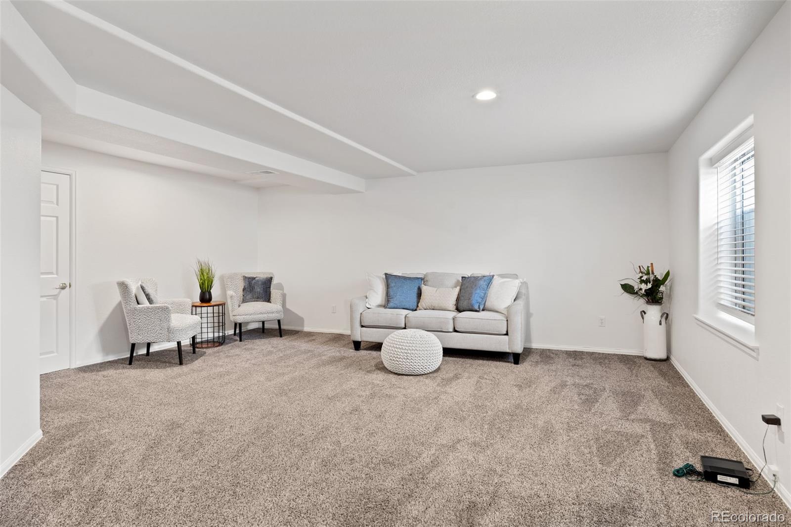 9838 Cypress Point Circle Lone Tree, CO 80124 - Photo 38 of 50 a living room with furniture and window