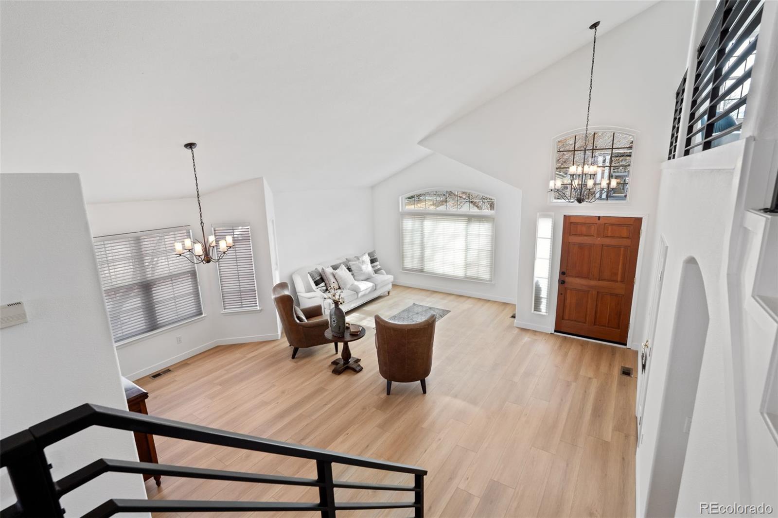 9838 Cypress Point Circle Lone Tree, CO 80124 - Photo 4 of 50 a living room with furniture a window and wooden floor